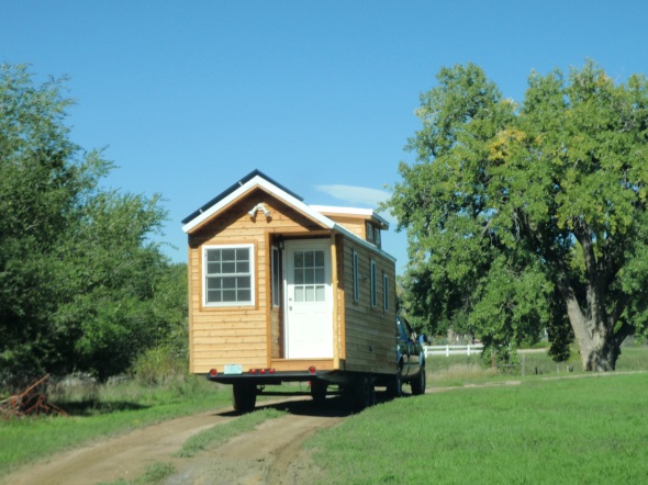 Tiny home moving day! Pulling our house down the dirt road. . .